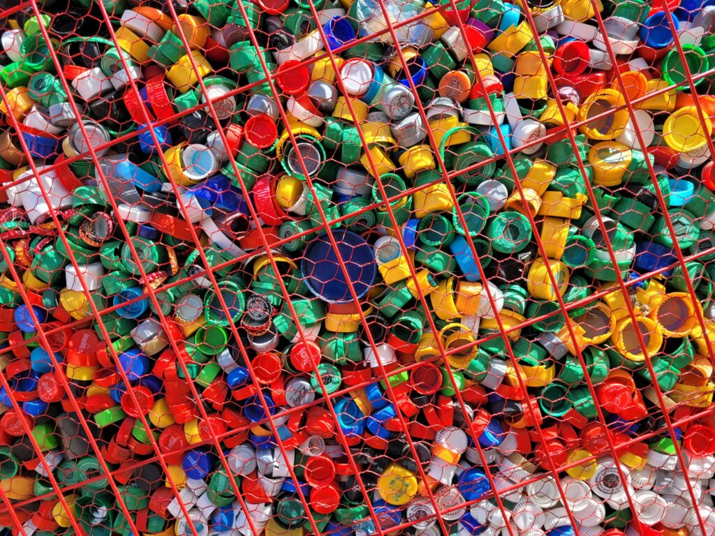 Plastic caps container, for recycling; green point in Portezuelo square